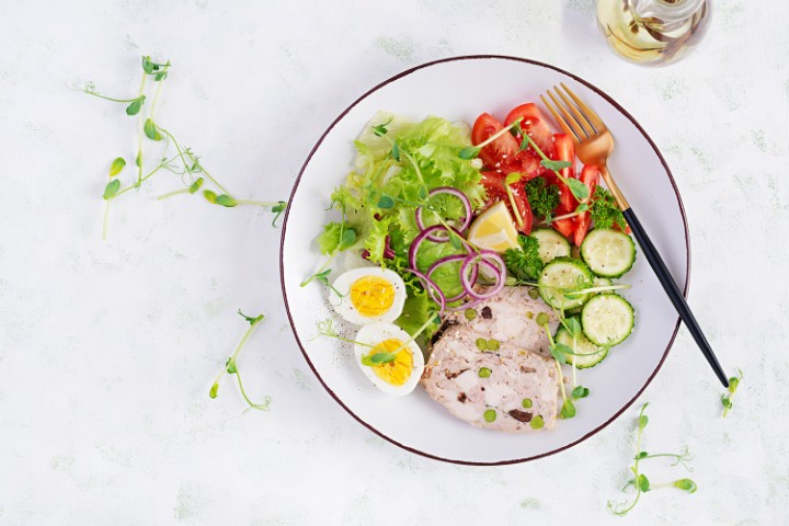Ketogenic diet. Boiled egg, meatloaf and fresh salad